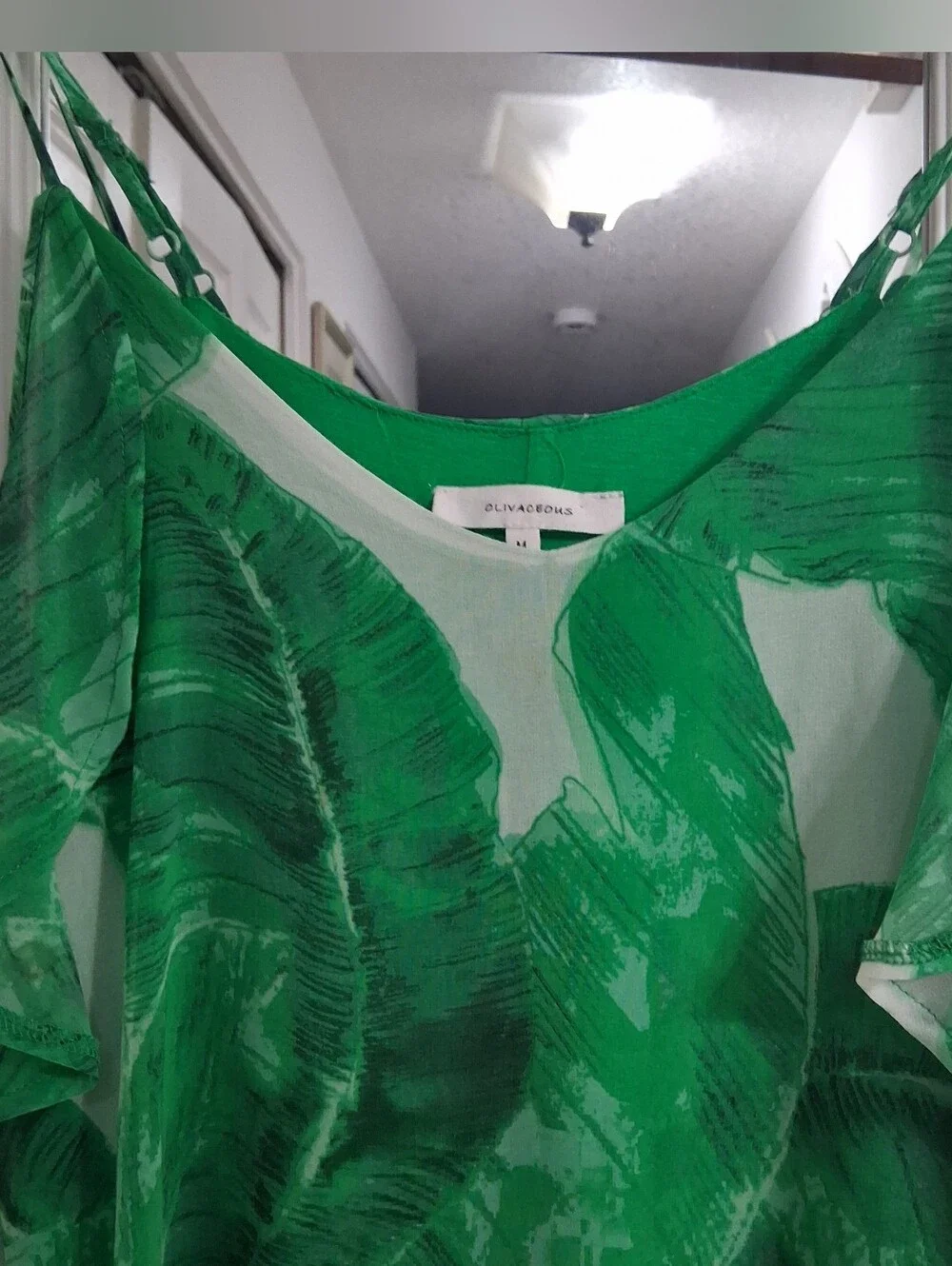 Olivacious Tropical Mini Dress With A Ruffled Cold Shoulder Hanging Sleeve